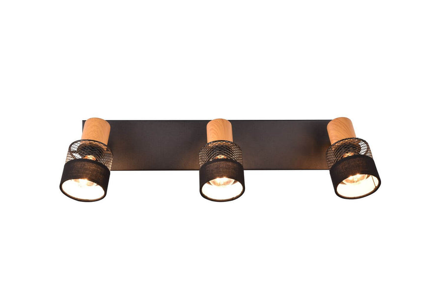Vue frontale du plafonnier trois lumières, barre rectangulaire noire et diffuseurs cylindriques.