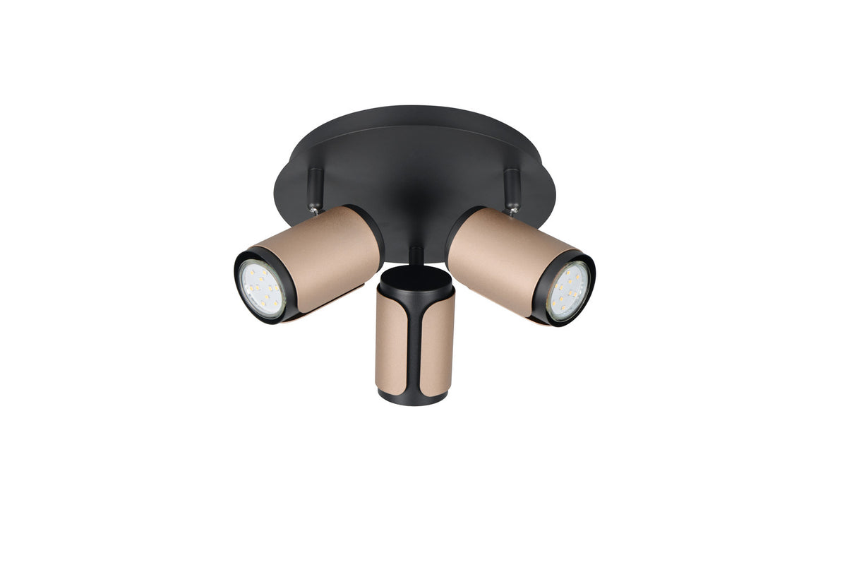 Face avant du luminaire éteint, trois têtes cylindriques beige à bord noir et base centrale.