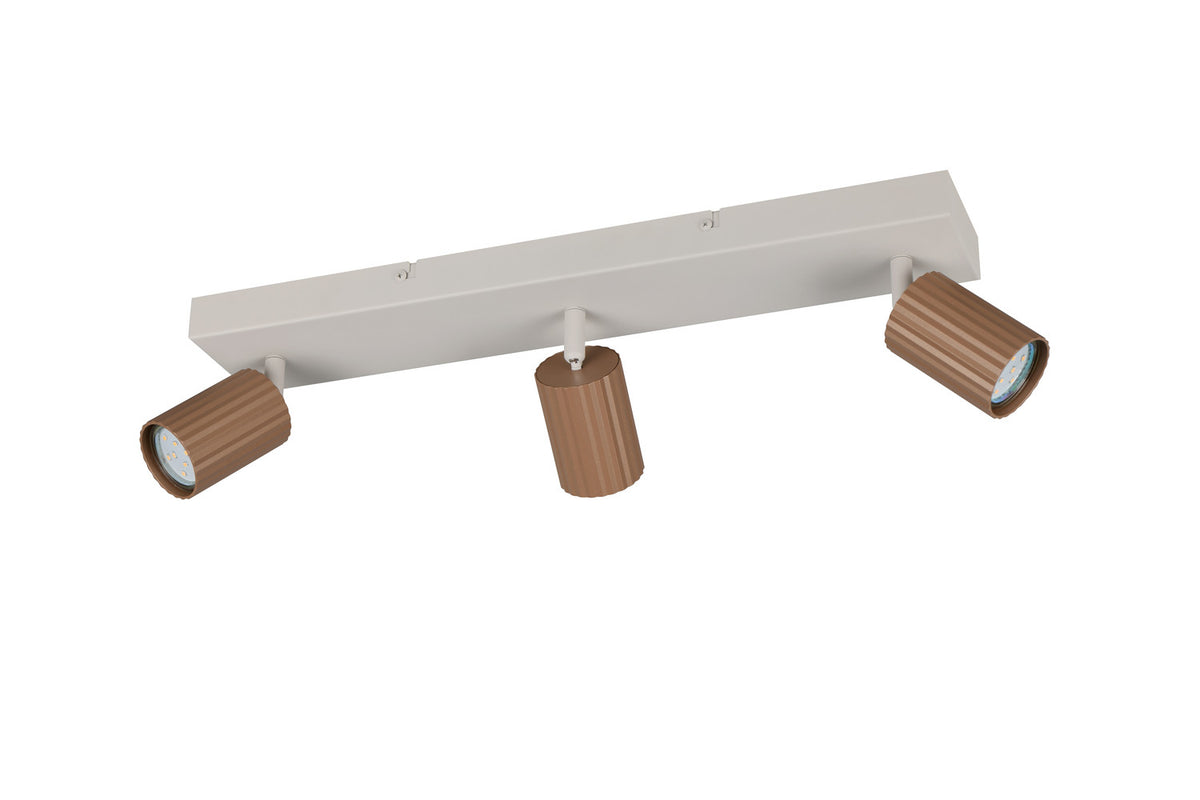 Vue en plongée du luminaire, trois projecteurs cylindriques orientables fixés sur une barre.