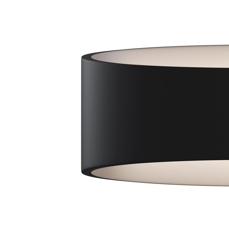 Détail rapproché du bord et de la finition intérieure beige du luminaire