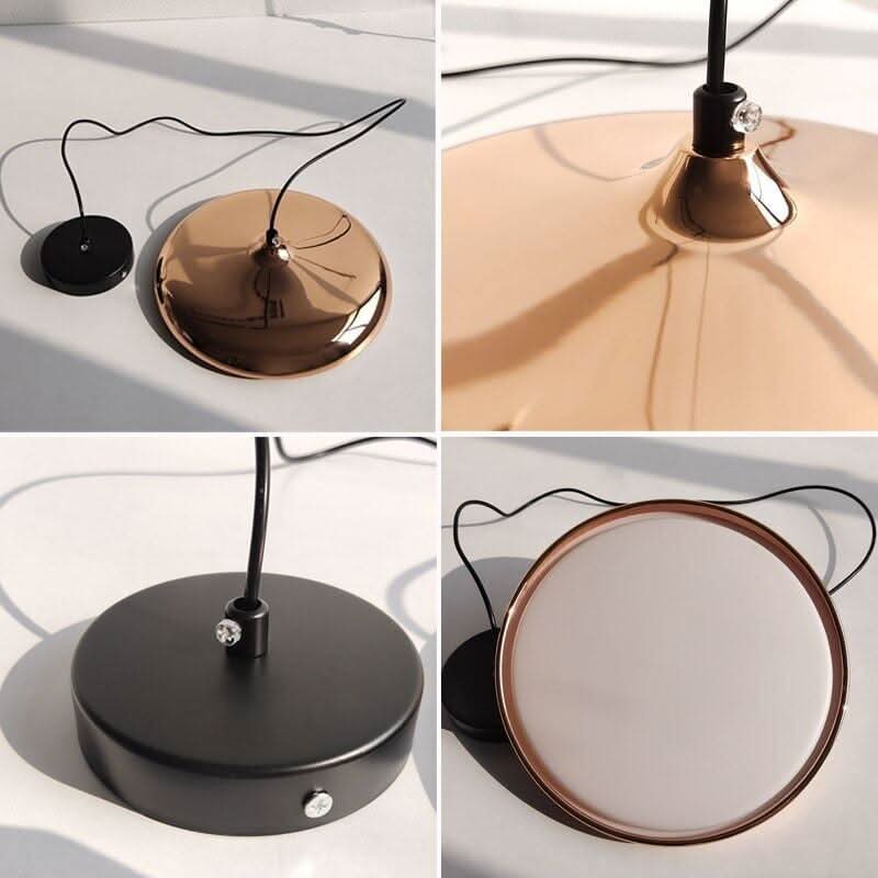 Détail du socle, du câble et de la finition cuivrée ou noire du luminaire.